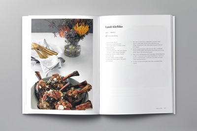Photo of a page spread showing the final cooked meal on the left and recipe on the right.