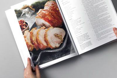 Photo of the cookbook showing the formatting of text images into the layout design.