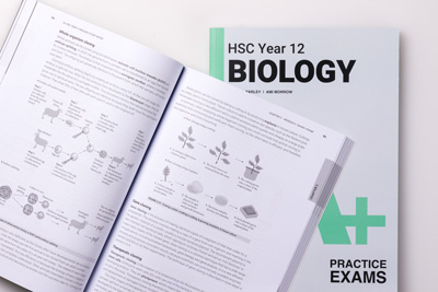 A+ HSC Year 12 Biology Study Notes open in front of a copy of the practice exams.