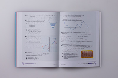 A double-page spread showing the complex arrangement of typography, equations, images and diagrams.