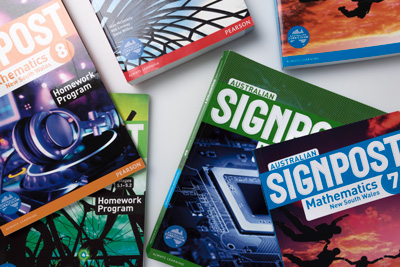 Photograph showing six books from the Australian Signpost Mathematics New South Wales series.
